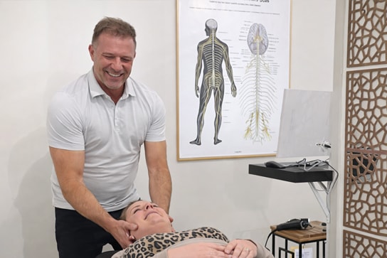 Dr. Michael Kricken with a patient at Lakeview Chiropractic