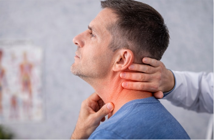 A chiropractor assessing neck mobility and function in a patient recovering from whiplash